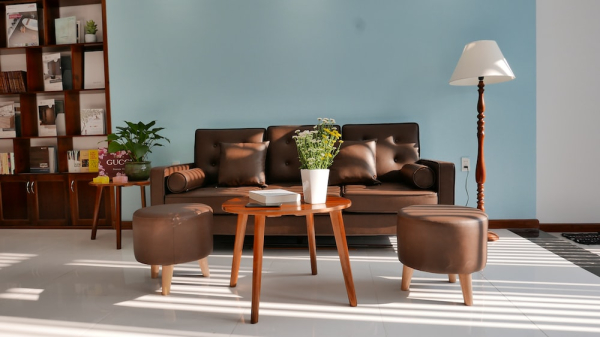 brown wooden table and gray couch